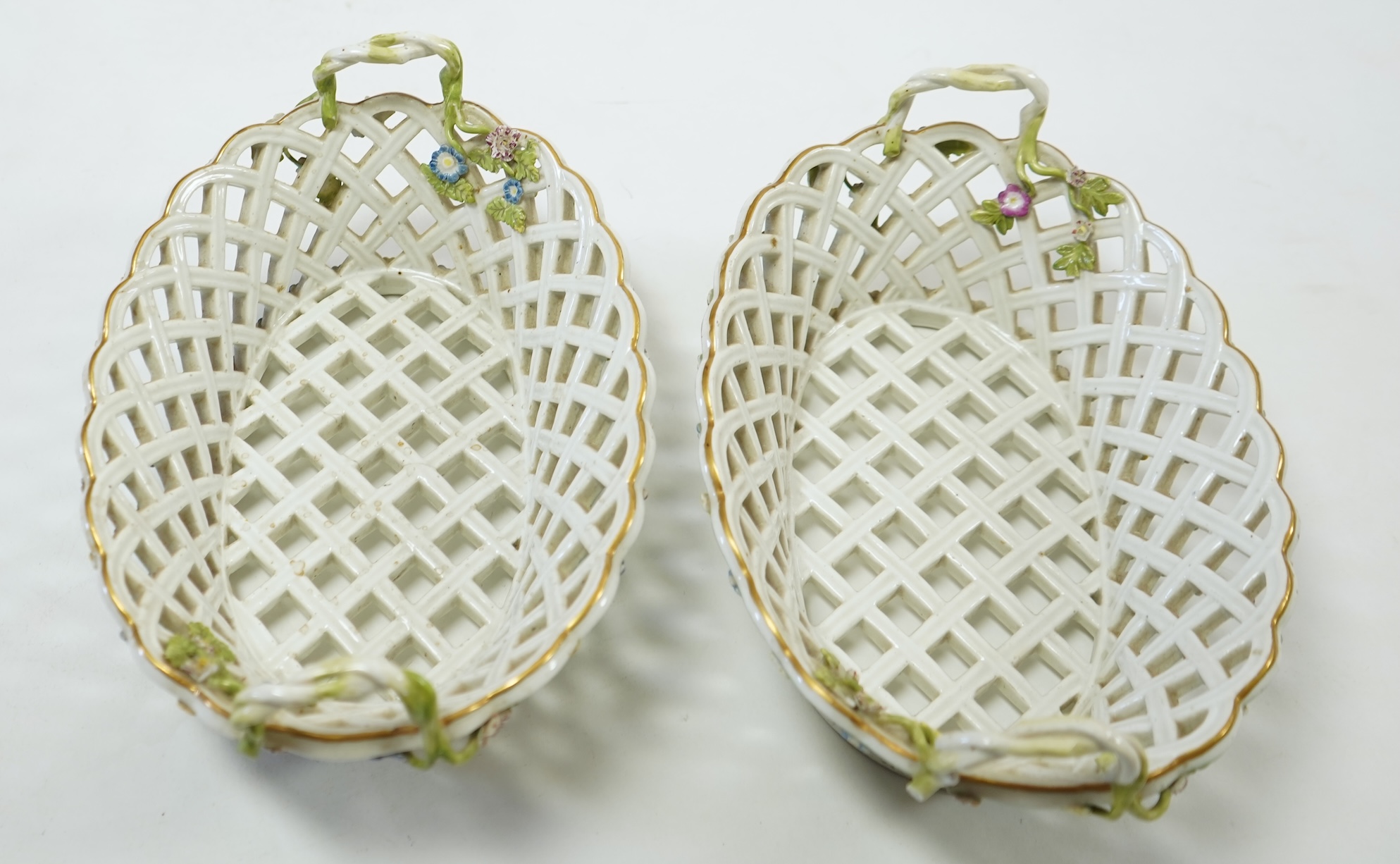 A pair of mid 18th century Meissen porcelain reticulated baskets c.1765